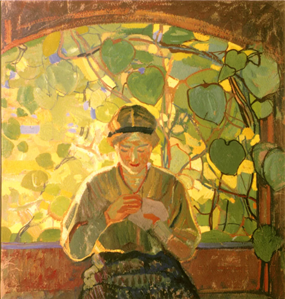 Femme assise devant une fenêtre sur jardin